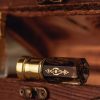 pexels photo 8796359 8796359 Close-up of vintage perfume bottles displaying intricate golden designs, set on a wooden surface.